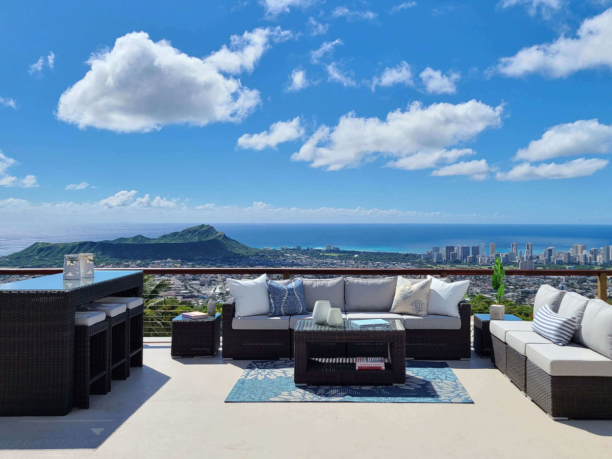 Outdoor patio furniture set with a scenic view of Honolulu and Diamond Head. 