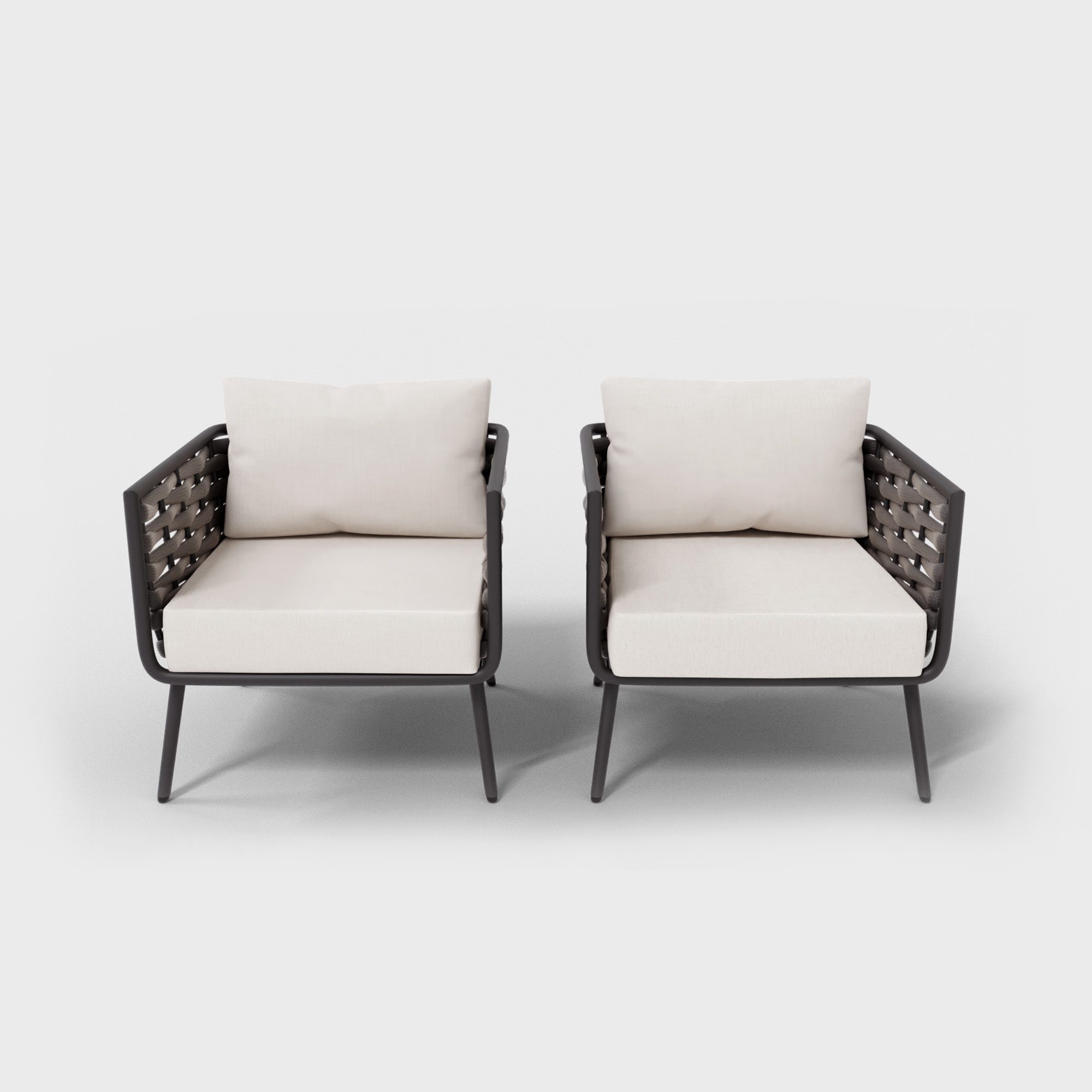 two rope armchairs with white cushions